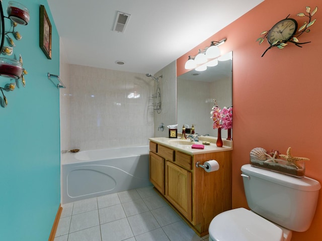 full bathroom with tile patterned flooring, vanity, toilet, and tiled shower / bath