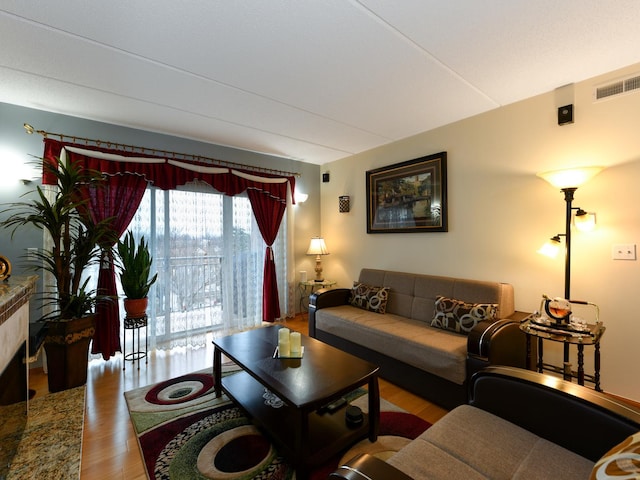 living room with light hardwood / wood-style flooring