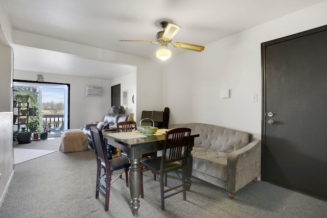 carpeted dining space featuring ceiling fan and a wall mounted AC