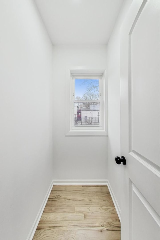 spare room with wood-type flooring