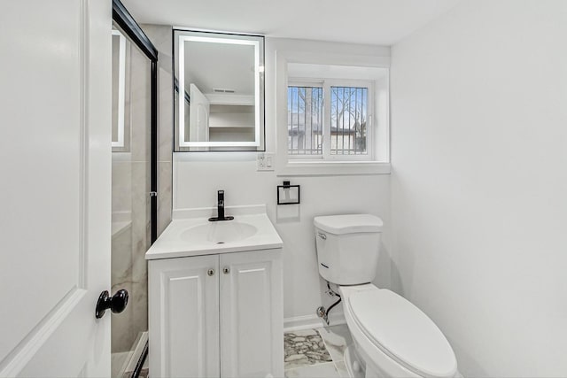 bathroom featuring toilet and vanity