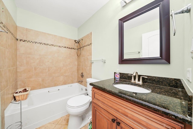 full bathroom featuring tile patterned floors, vanity, toilet, and tiled shower / bath combo