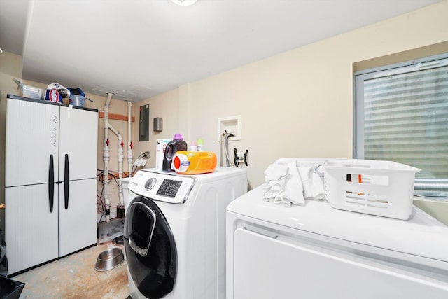 laundry room featuring washing machine and dryer