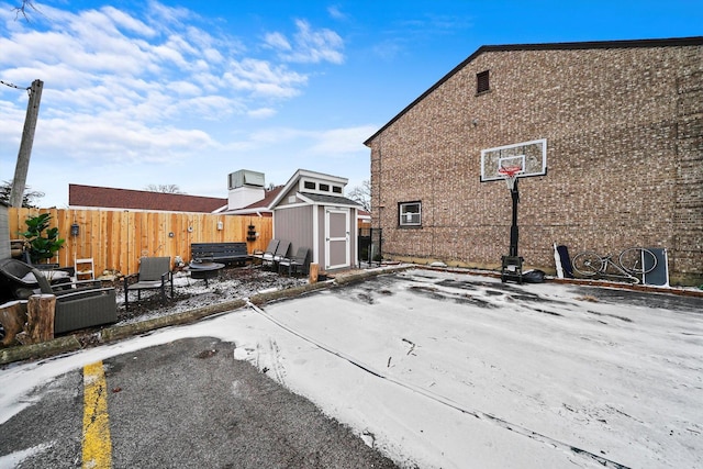 back of house with a patio area and a storage shed