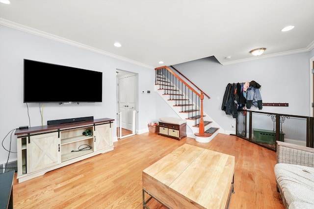 living room featuring wood-type flooring and ornamental molding