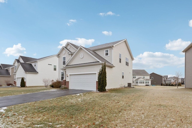 view of home's exterior featuring a yard and a garage