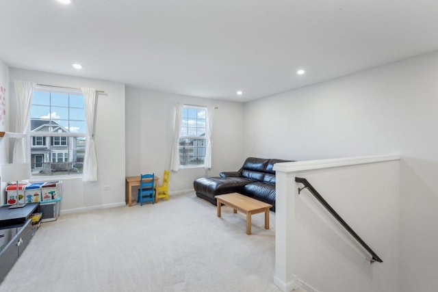 living area featuring light colored carpet