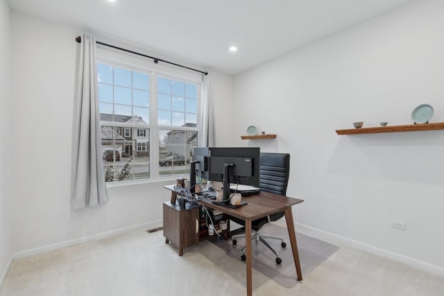 office area featuring light carpet