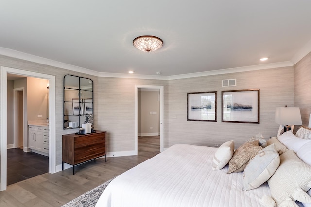 bedroom featuring ensuite bathroom, crown molding, and dark wood-type flooring