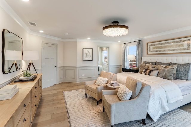 bedroom featuring light wood-type flooring and ornamental molding