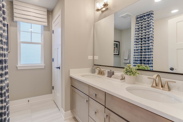 bathroom with vanity and tile patterned floors