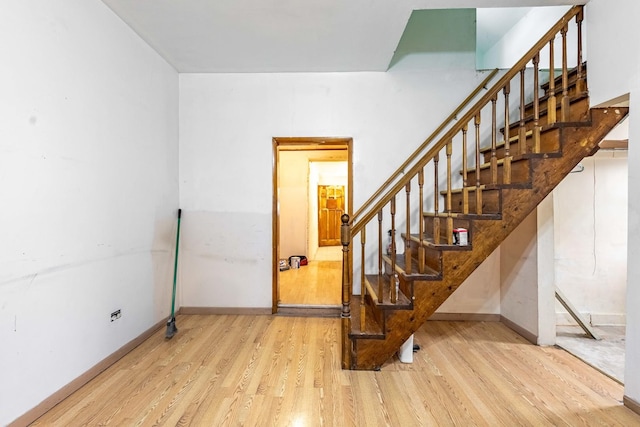 staircase featuring hardwood / wood-style flooring