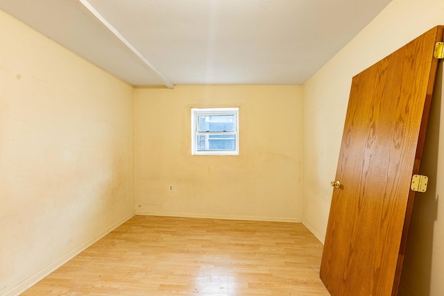 empty room with light hardwood / wood-style flooring