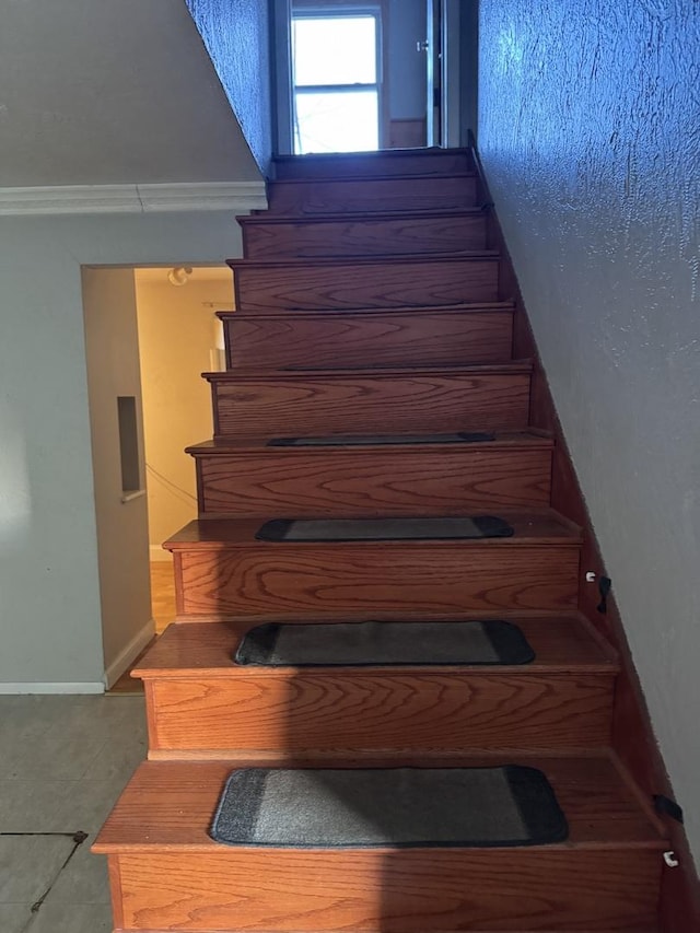 staircase with crown molding