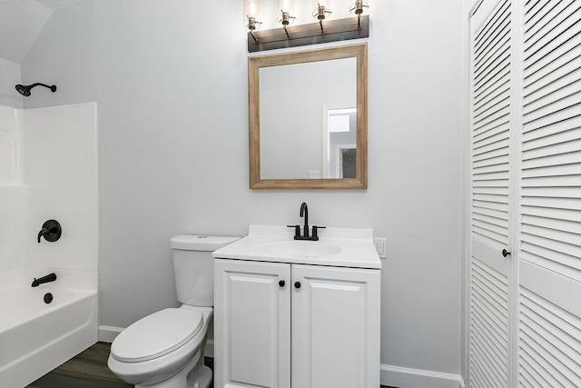 full bathroom with vanity, lofted ceiling, shower / tub combination, hardwood / wood-style flooring, and toilet