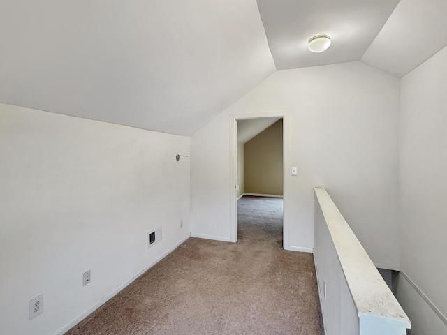 bonus room featuring light carpet and lofted ceiling