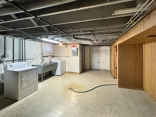 basement with sink and washer and dryer