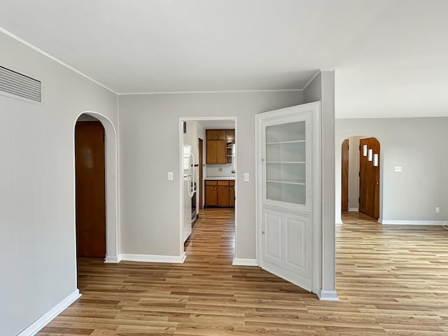 corridor featuring light hardwood / wood-style floors