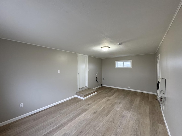 interior space with light wood-type flooring and heating unit