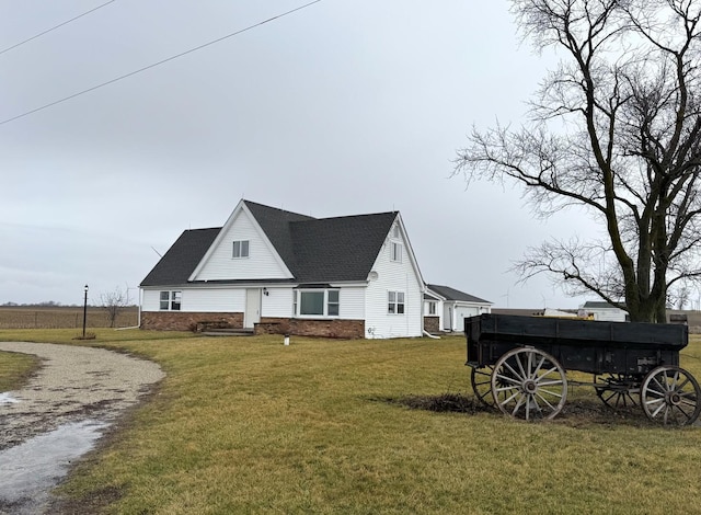 back of property featuring a lawn