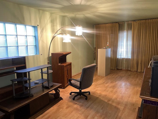 office with light hardwood / wood-style floors