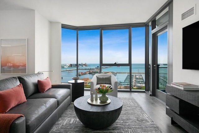 living room featuring hardwood / wood-style flooring and floor to ceiling windows