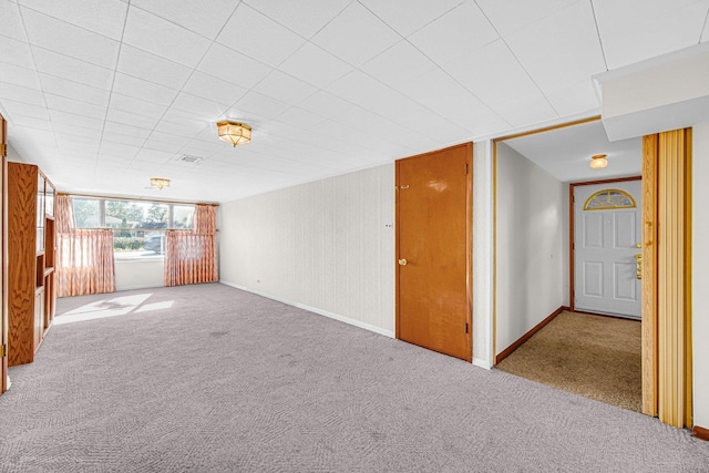 unfurnished living room with light colored carpet