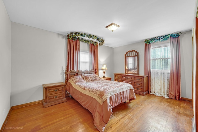 bedroom with light hardwood / wood-style flooring