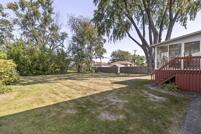 view of yard featuring a sunroom