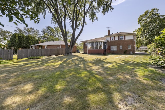 view of yard with a sunroom