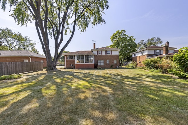 view of yard with a sunroom