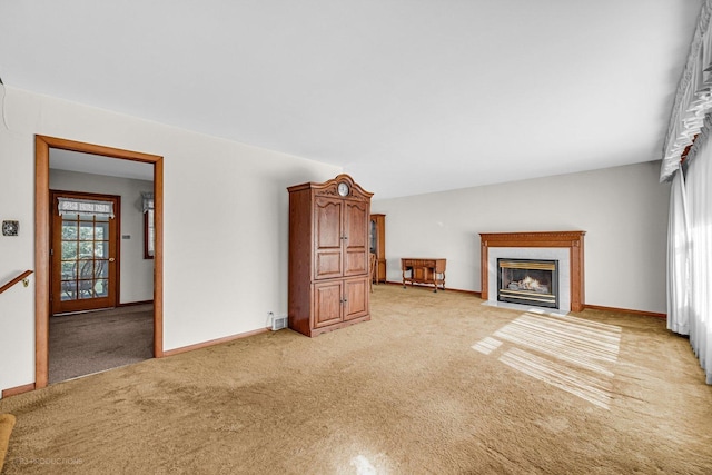 unfurnished living room with light colored carpet