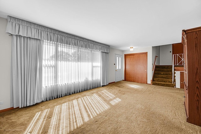 unfurnished living room with carpet flooring