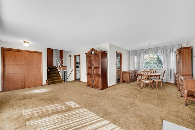 unfurnished dining area with light carpet and a notable chandelier