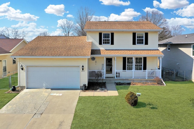 traditional-style house featuring a garage, driveway, covered porch, fence, and a front yard