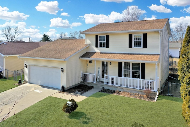 traditional-style home featuring a garage, driveway, a porch, and a front yard