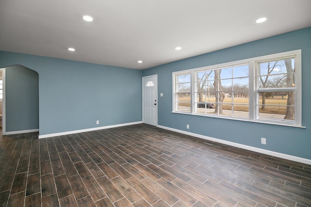 spare room with dark wood-type flooring