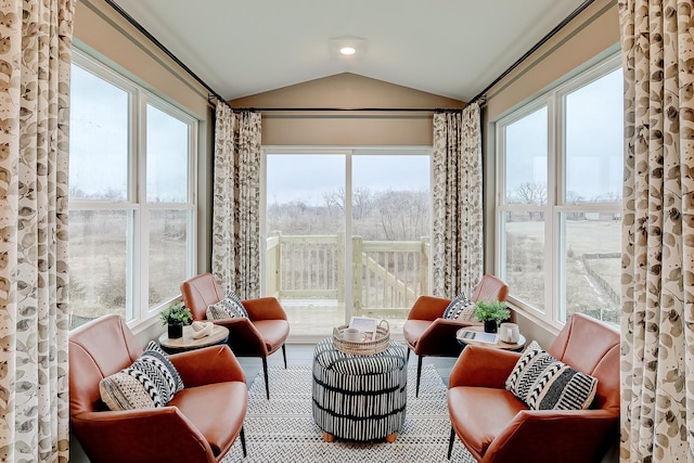 sunroom / solarium featuring lofted ceiling