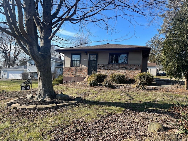 1614 N Ave, Round Lake Beach, IL 60073 - view of front facade featuring a front lawn