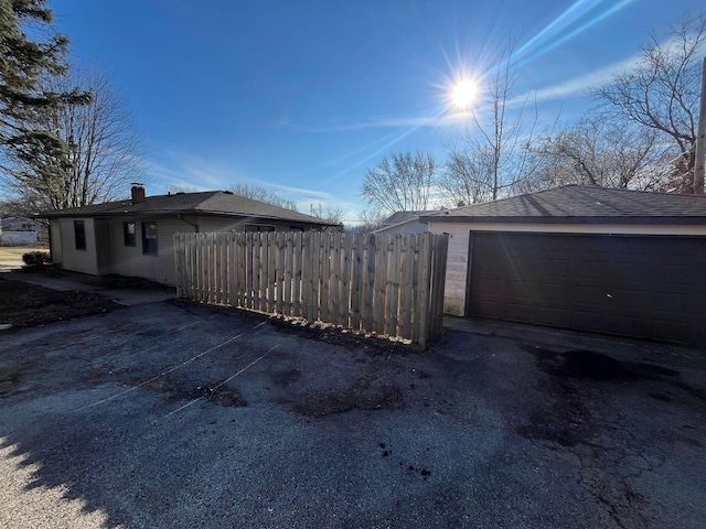 view of side of home with a garage