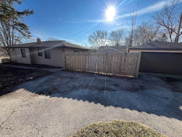 view of side of home with a garage