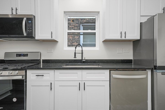 kitchen with white cabinetry, sink, and stainless steel appliances