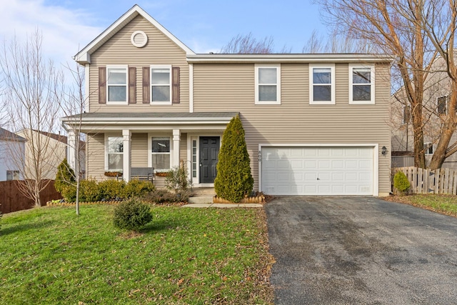 front of property with a garage and a front lawn