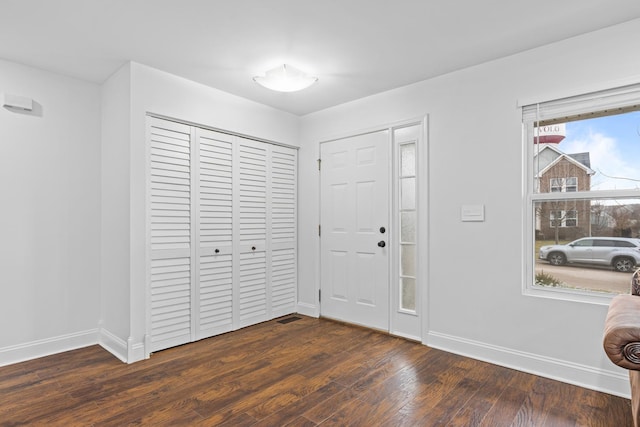 foyer with dark hardwood / wood-style flooring