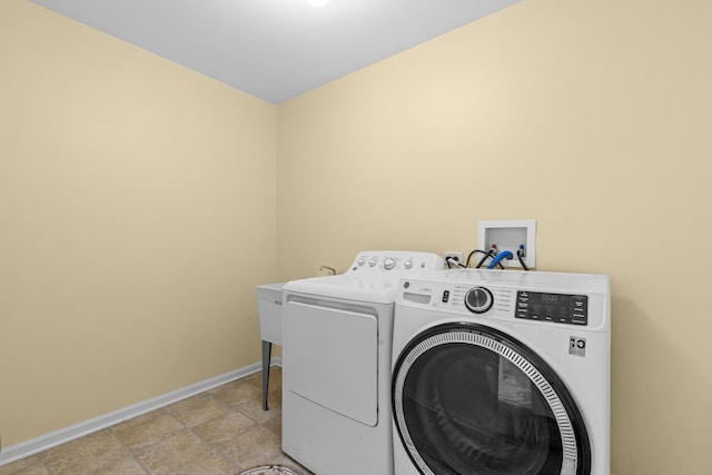 clothes washing area featuring washing machine and clothes dryer