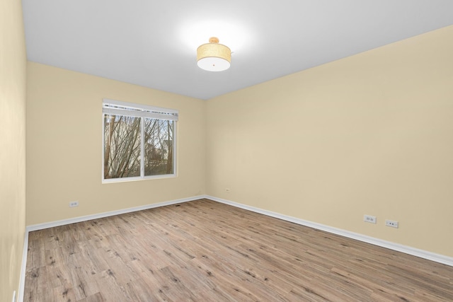 unfurnished room with light hardwood / wood-style flooring