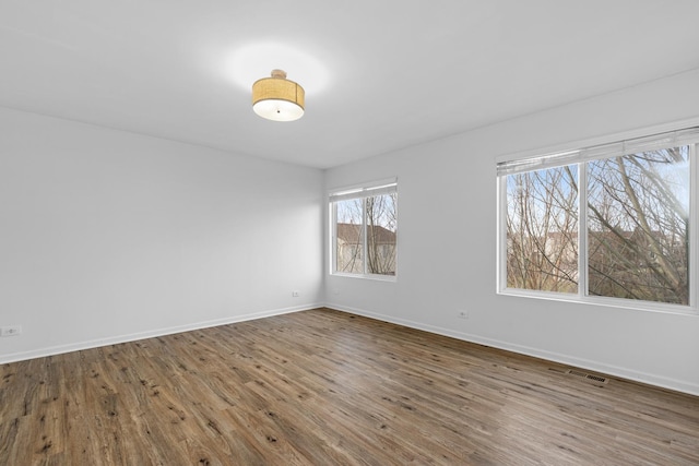 spare room featuring hardwood / wood-style floors