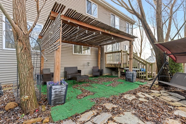 view of patio with a pergola and a wooden deck