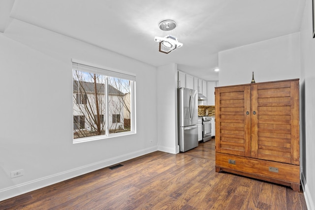 dining room with dark wood-type flooring