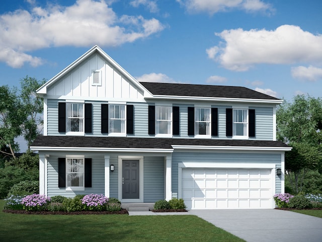 view of front of house featuring a front lawn and a garage